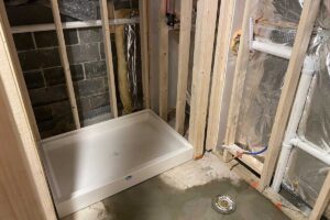 Totally Plumbing - Rough plumbing installation including an ejector tank for a full bathroom with a stall shower in a finished basement - Voorhees, New Jersey – December 2021