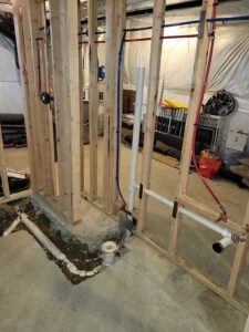 Totally Plumbing - Rough plumbing installation including an ejector tank for a full bathroom with a stall shower in a finished basement - Avondale, Pennsylvania – March 2022