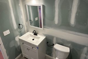 Totally Plumbing - Rough and finished plumbing installation including sink, faucet, toilet, stall shower, and shower trim for a full bathroom in a finished basement in Columbus, New Jersey – June 2023