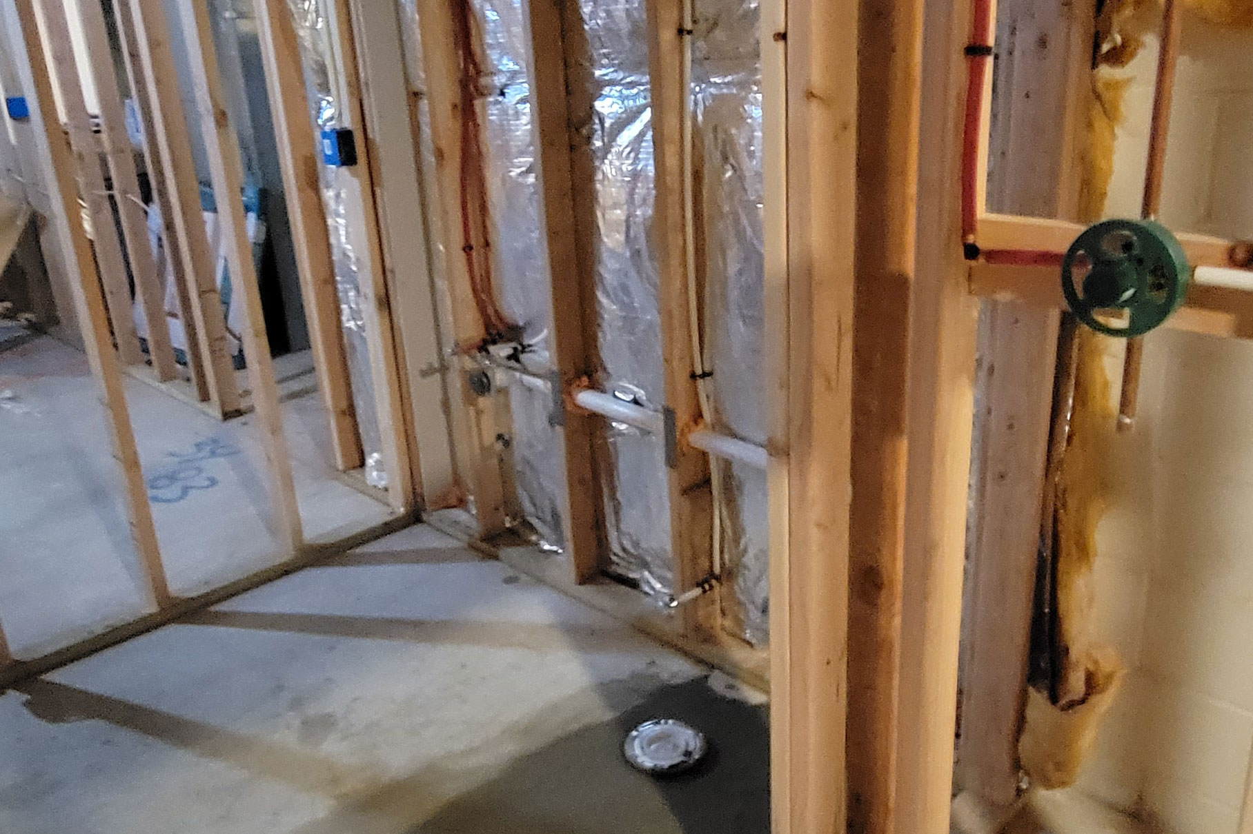 Totally Plumbing - Rough plumbing installation for a sink, faucet, toilet, stall shower, and ejector tank for a full bathroom in a finished basement in Brick, New Jersey – September 2023