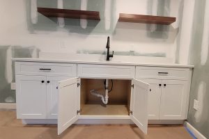 Totally Plumbing - Finished plumbing installation including vanity, sink, faucet, toilet, stall shower, and shower trim for a full bathroom and vanity, sink, and faucet for a wet bar in a finished basement in Neptune, New Jersey – September 2023