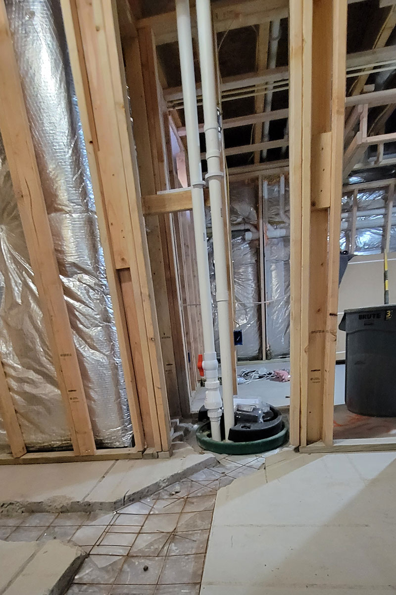 Totally Plumbing - Rough plumbing installation for a sink, faucet, toilet, stall shower, and ejector tank for a full bathroom in a finished basement in Princeton, New Jersey – November 2023